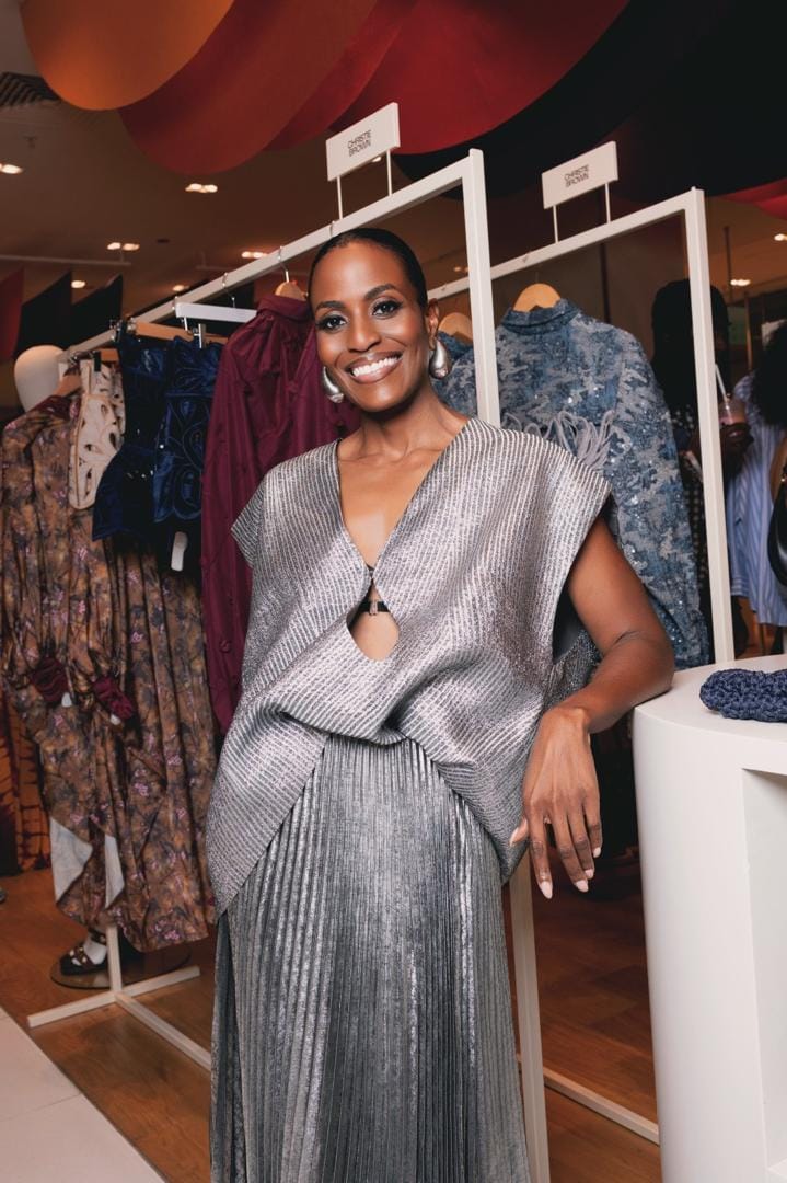 A guest photographed in front of the Christie Brown rack