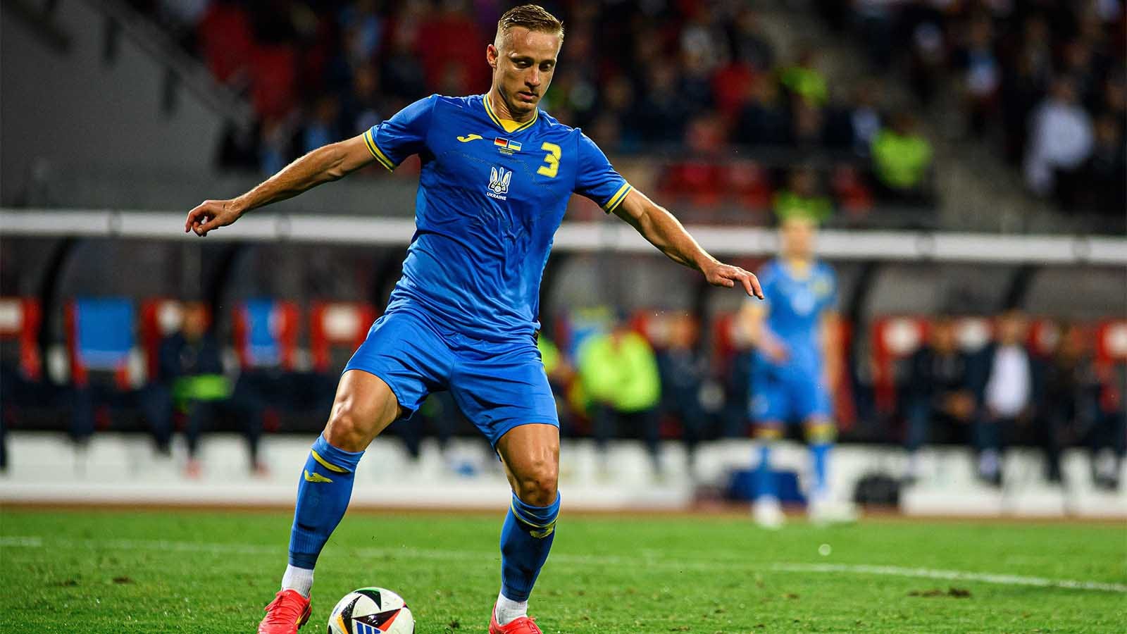 Oleksandr Svatok playing soccer with Ukraine