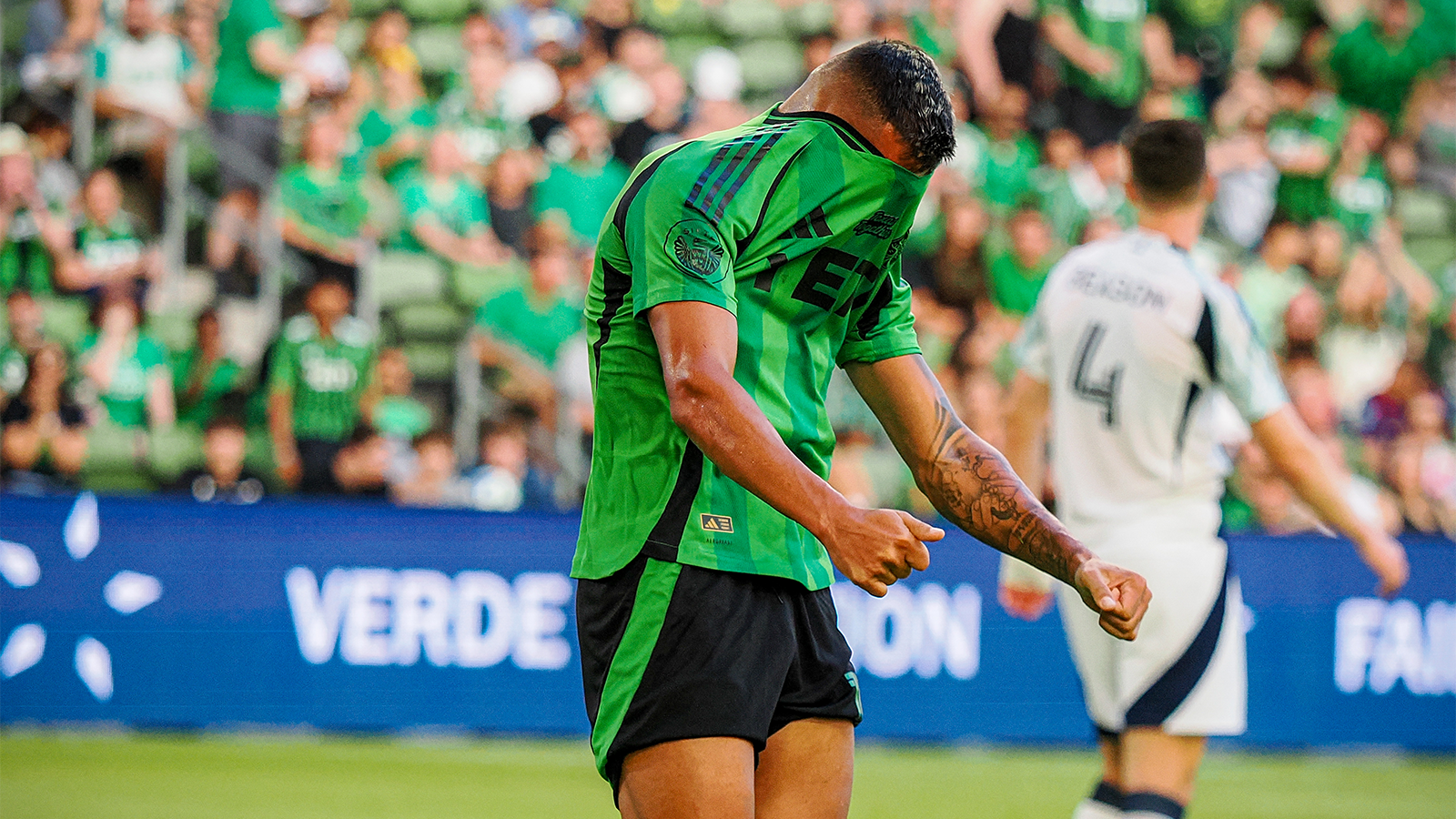 Myrto Uzuni with head in jersey