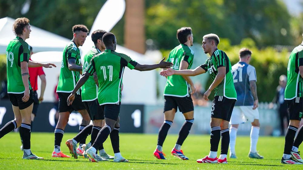 Osman Bukari and Owen Wolff low-five each other