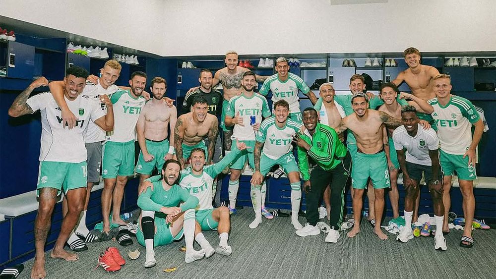 Austin FC celebrating win against St. Louis City SC in locker room 