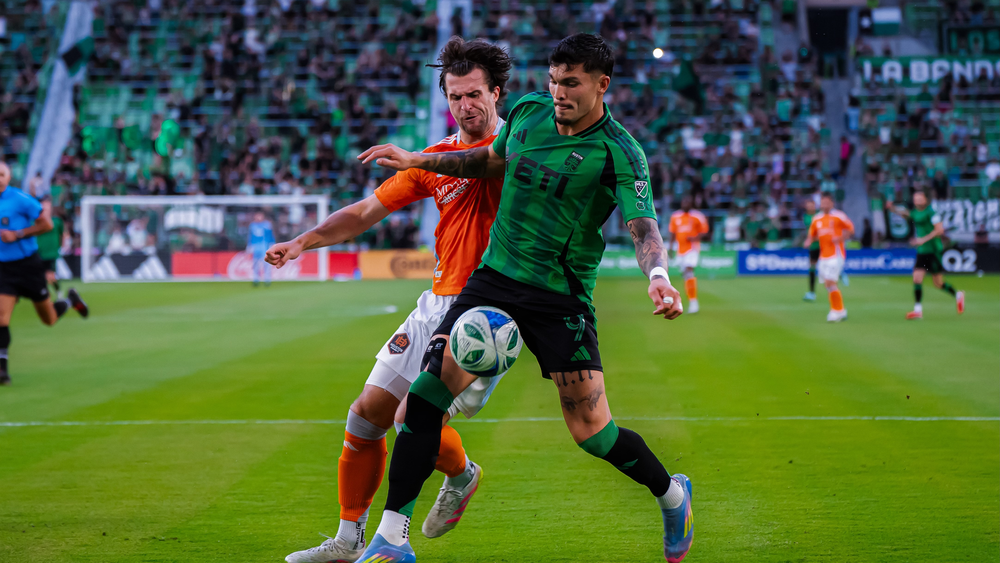 Austin FC's Brandon Vázquez possessing ball against a Houston defender 