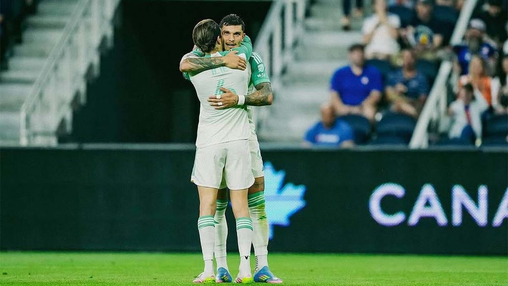 Ilie Sanchez and Brandon Vazquez hugging after Vazquez scores PK