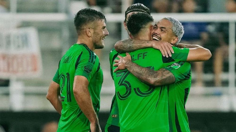Dani Pereira hugs Owen Wolff after Wolff scores goal against D.C. United 