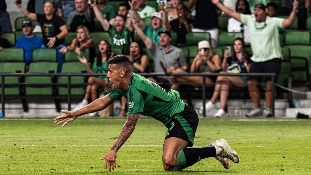 Myrto Uzuni on the turf, upset a referee didn't call a foul against him