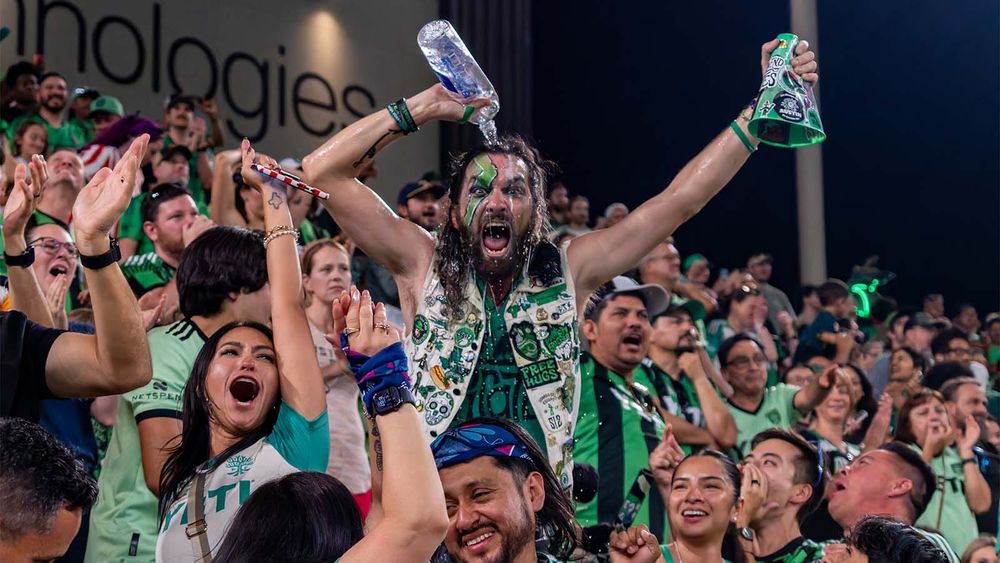A North End Pirate pours water on his head and celebrates with fans in Q2 Stadium