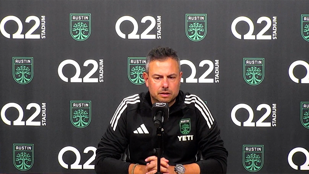 Nico Estévez sitting in front of mike at an Austin FC press conference