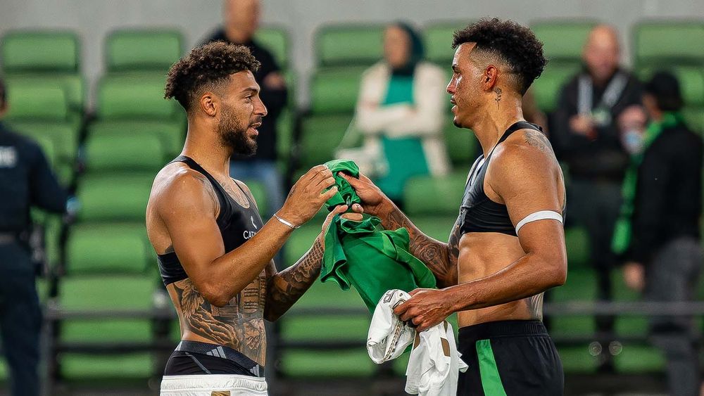 LAFC's Denis Bouanga and Austin FC's Julio Cascante trade jerseys after their playoff match