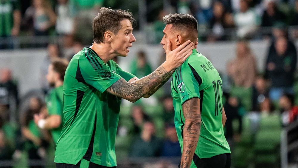 Robert Taylor consoling Myrto Uzuni