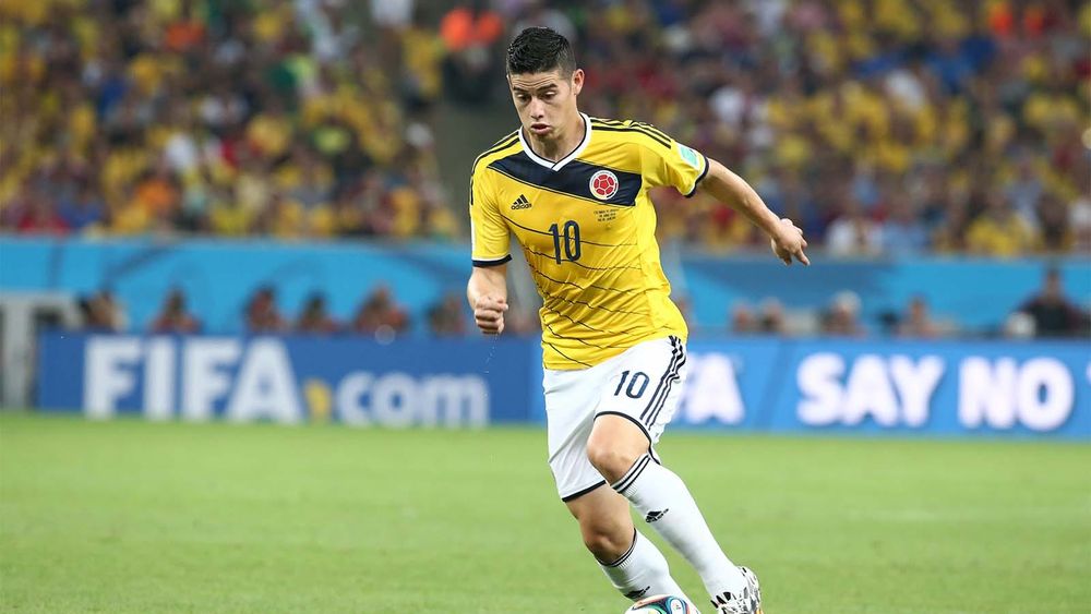 James Rodriguez, dribbling ball, playing for Colombia in the 2014 World Cup