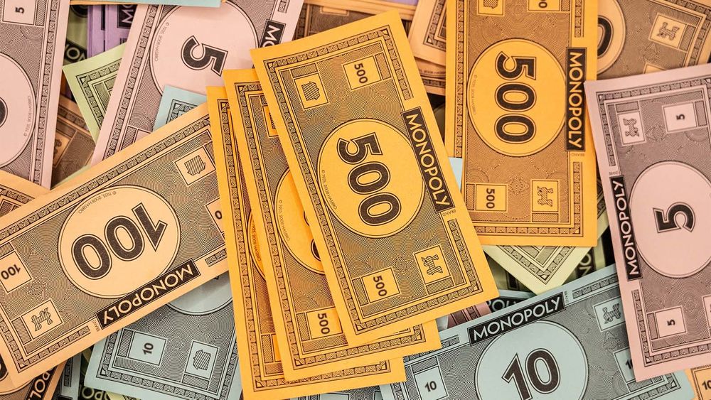 Monopoly money in various denominations (including $500 and $100) 