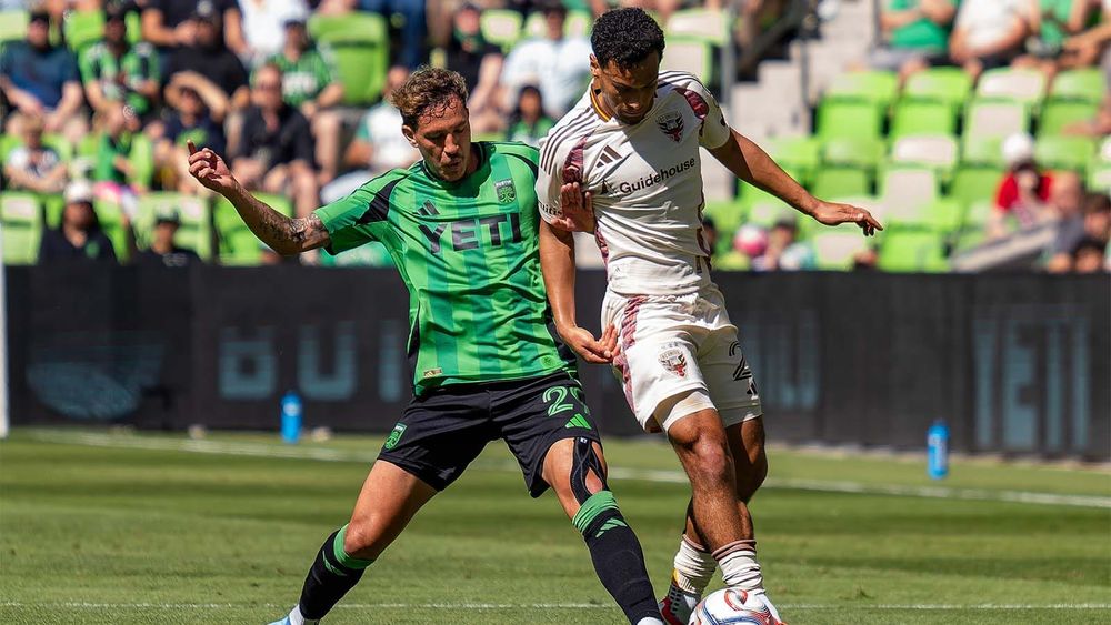 Guilherme Biro defending against a D.C. United player 