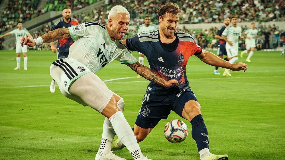 Austin FC's Christian Ramirez fighting for ball with Houston Dynamo defender