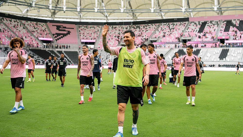 Lionel Messi and other Inter Miami players walking out onto their new home pitch for a practice