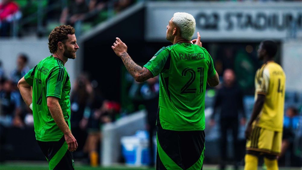Austin FC's Jon Gallagher and Christian Ramirez celebrating the team's opening goal against St. Louis
