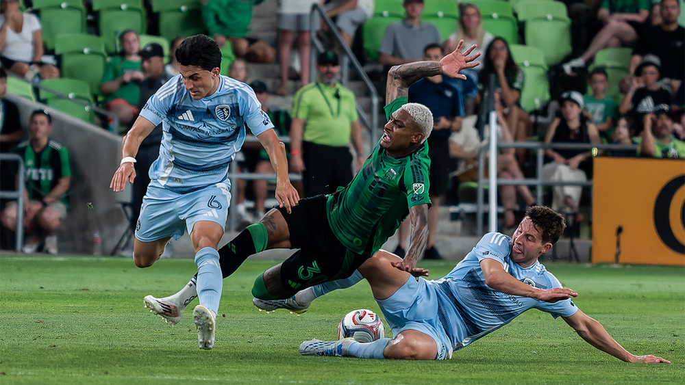 Austin FC's Joseph Rosales possibly getting fouled by an SKC player 