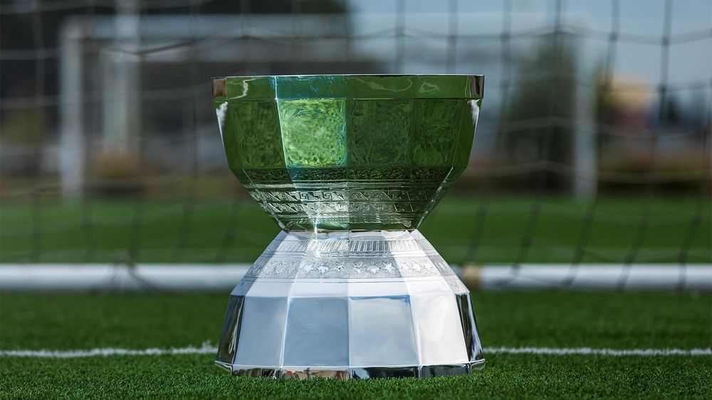 2026 Leagues Cup trophy on soccer field in front of goal net
