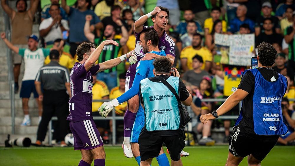Brad Stuver hugging Jorge Alastuey after Austin FC's PK win over Club América