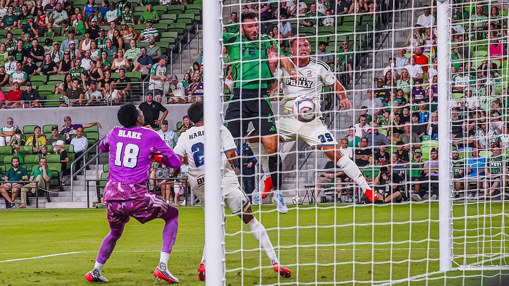Austin FC's Brendan Hines-Ike heading in a goal past Philadelphia Union players