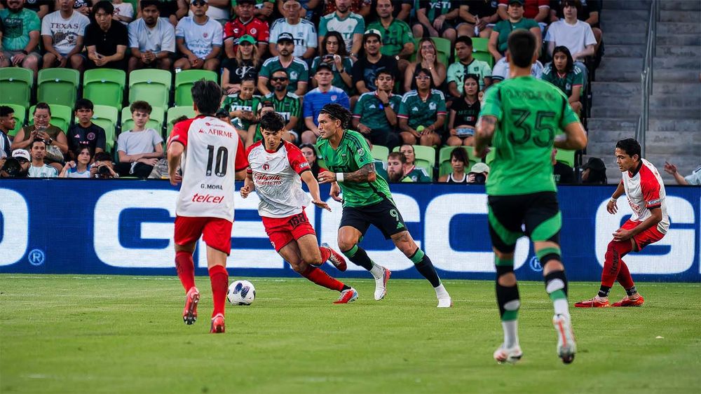 Austin FC's Brandon Vázquez trying to progress the ball against Tijuana defenders