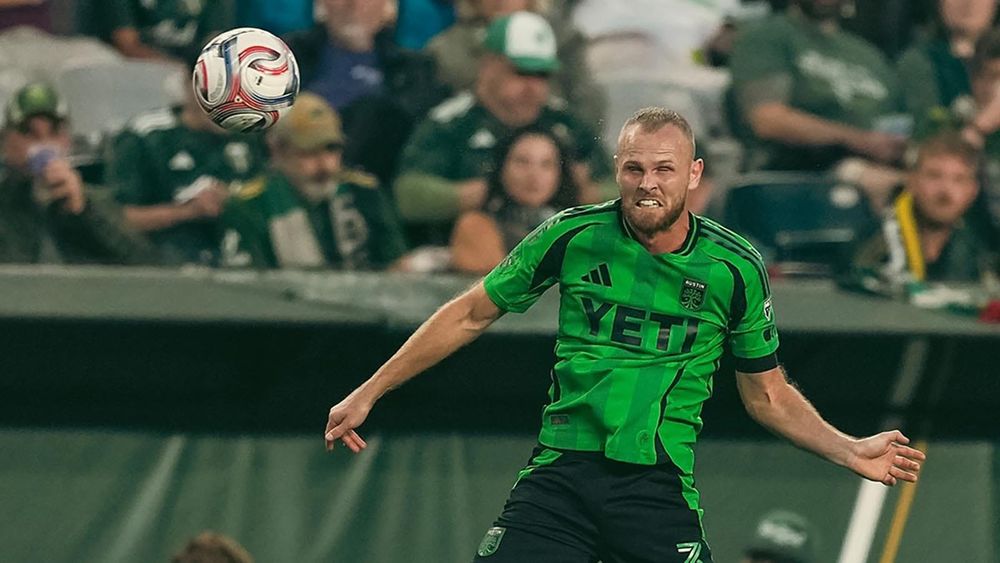Mikkel Desler heading a ball against Portland Timbers FC 