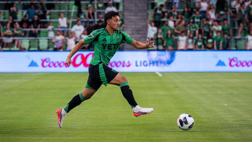 Owen Wolff dribbling ball downfield