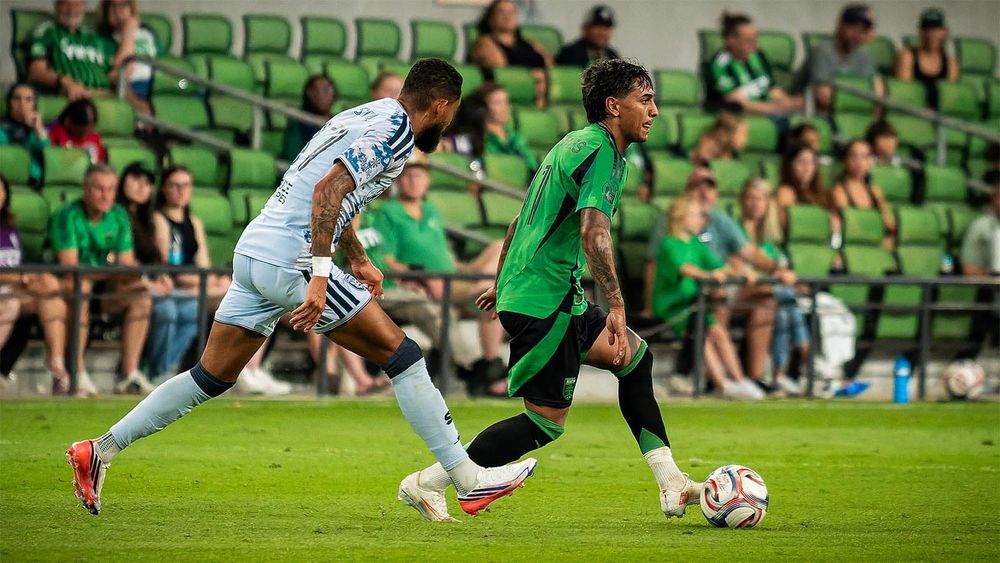 Austin FC's Facundo Torres, dribbling ball with San Jose Earthquakes player in pursuit
