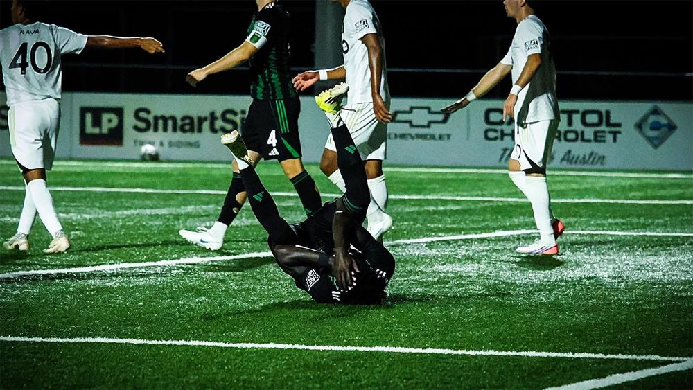 Austin FC II's Ibrahima Sall covers his face while on the ground during the team's playoff loss