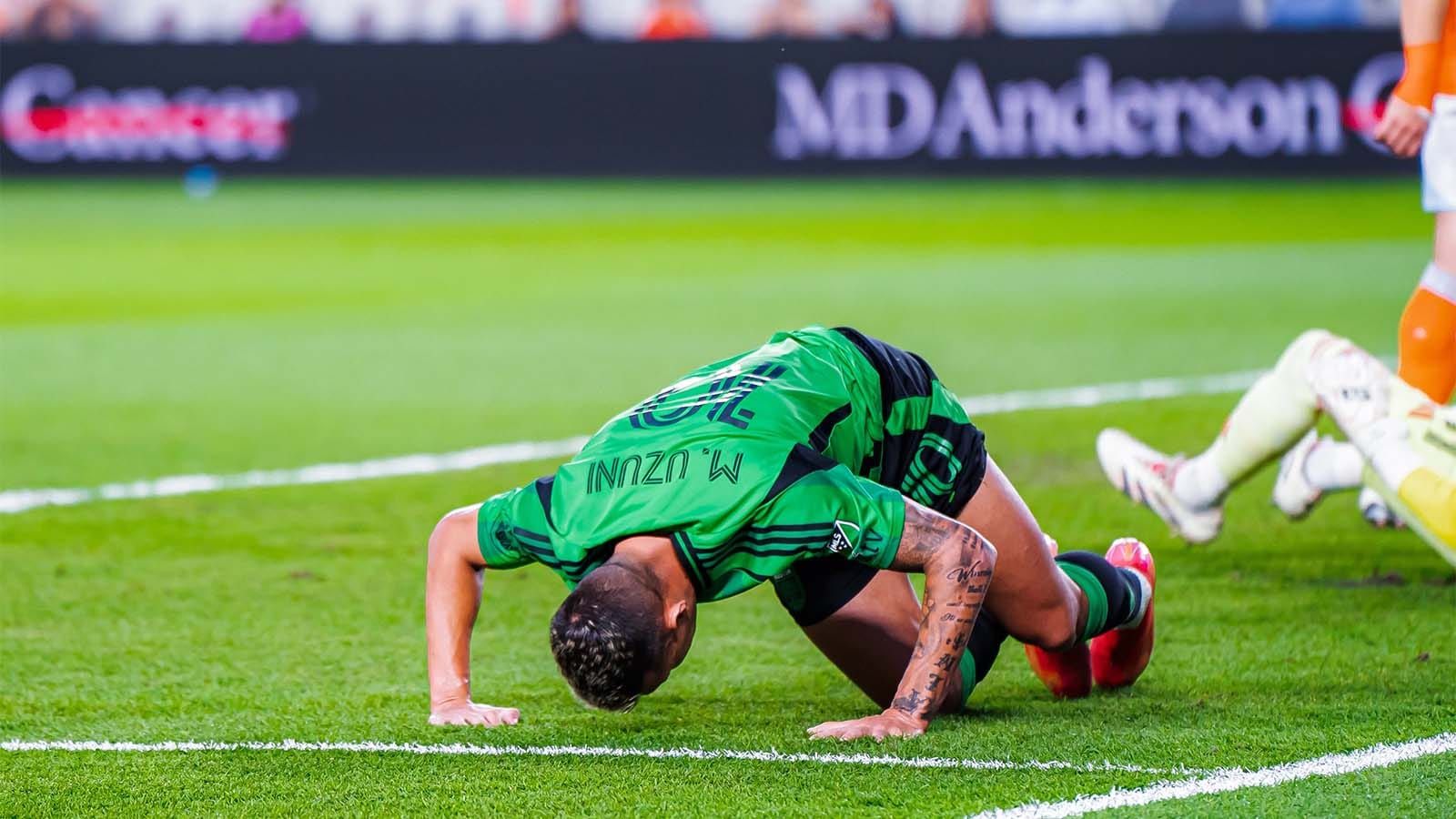 Myrto Uzuni, lying on the ground and frustrated, in match vs. Houston Dynamo