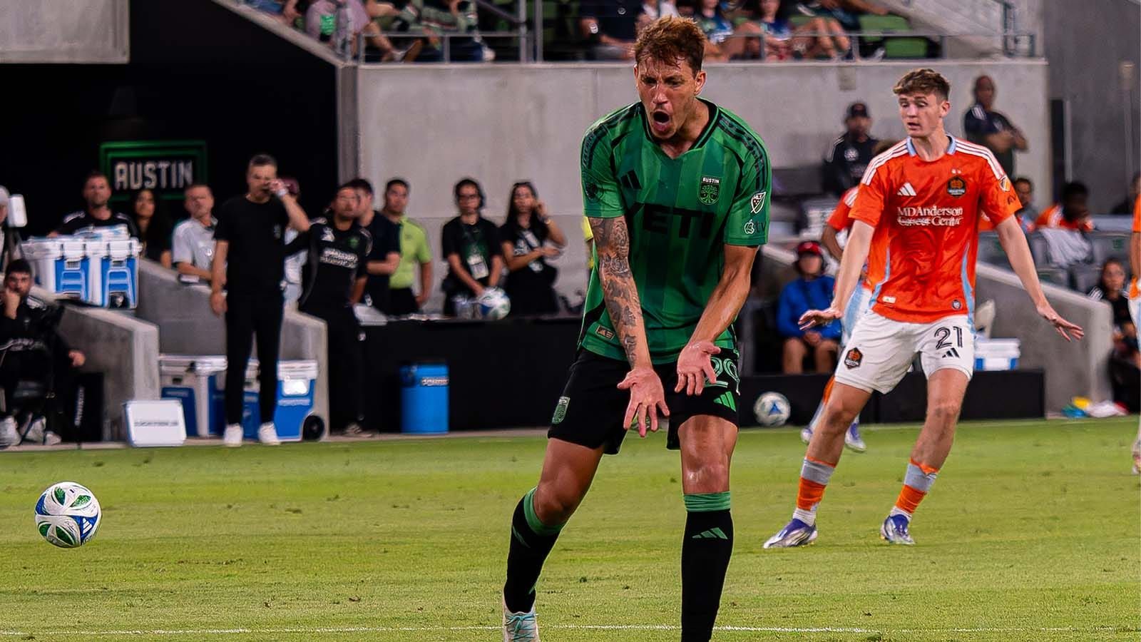 Guilherme Biro, frustrated in a match against Houston (with Houston's Jack McGlynn behind him)