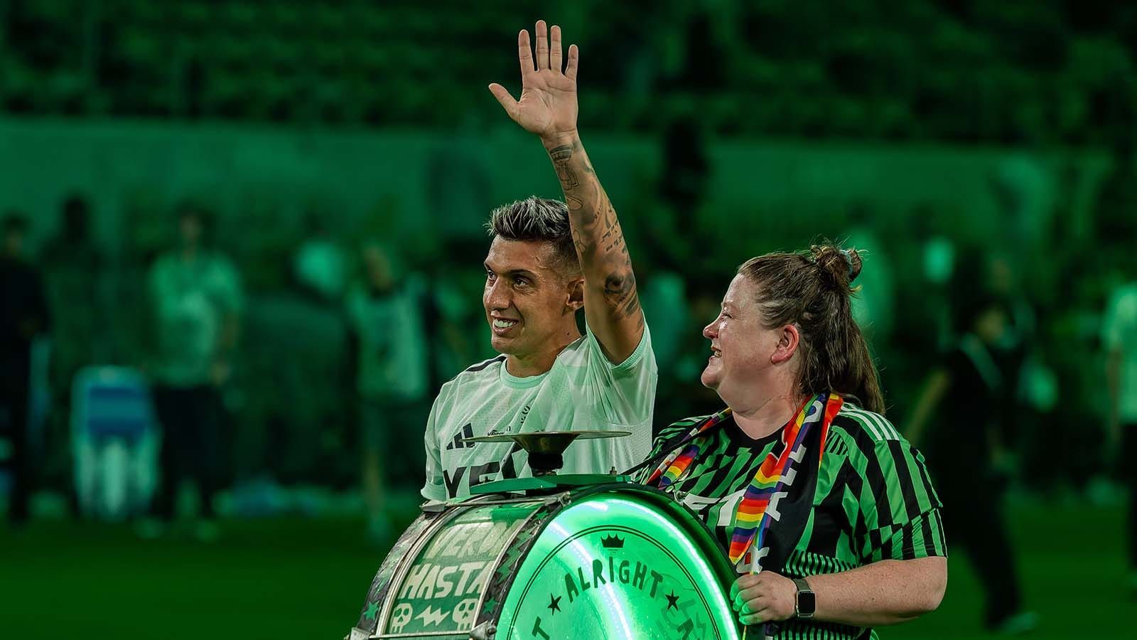 Myrto Uzuni with fan getting Man of the Match award at 4/25 match against Houston