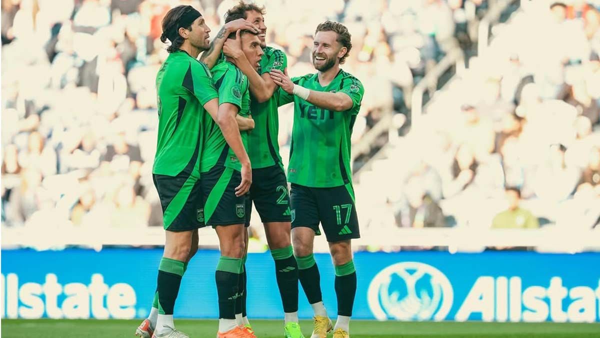 Myrto Uzuni hugged by teammates afer scoring a PK goal for Austin FC over Minnesota United FC