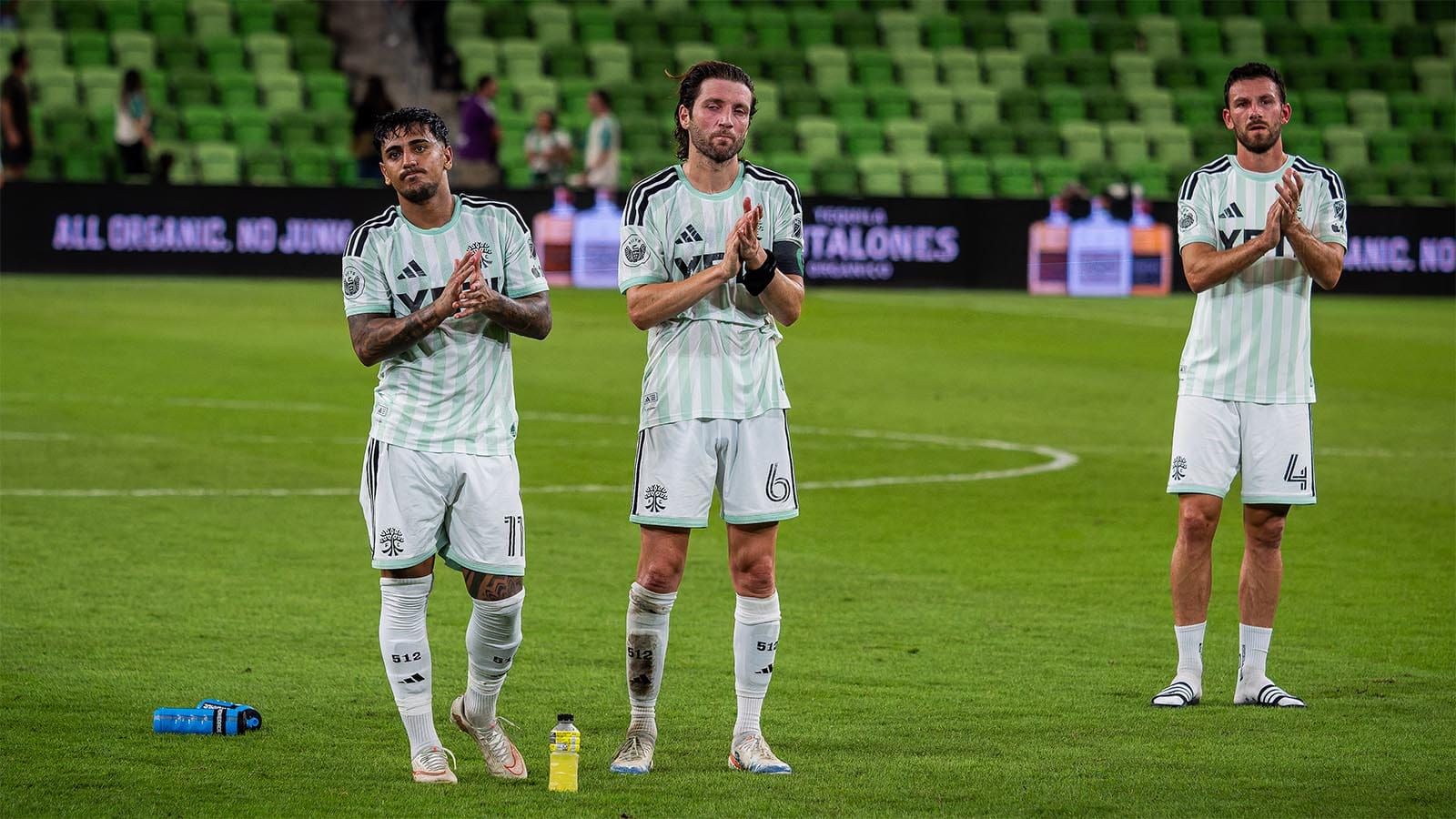Austin FC players applaud fans after losing to Real Salt Lake