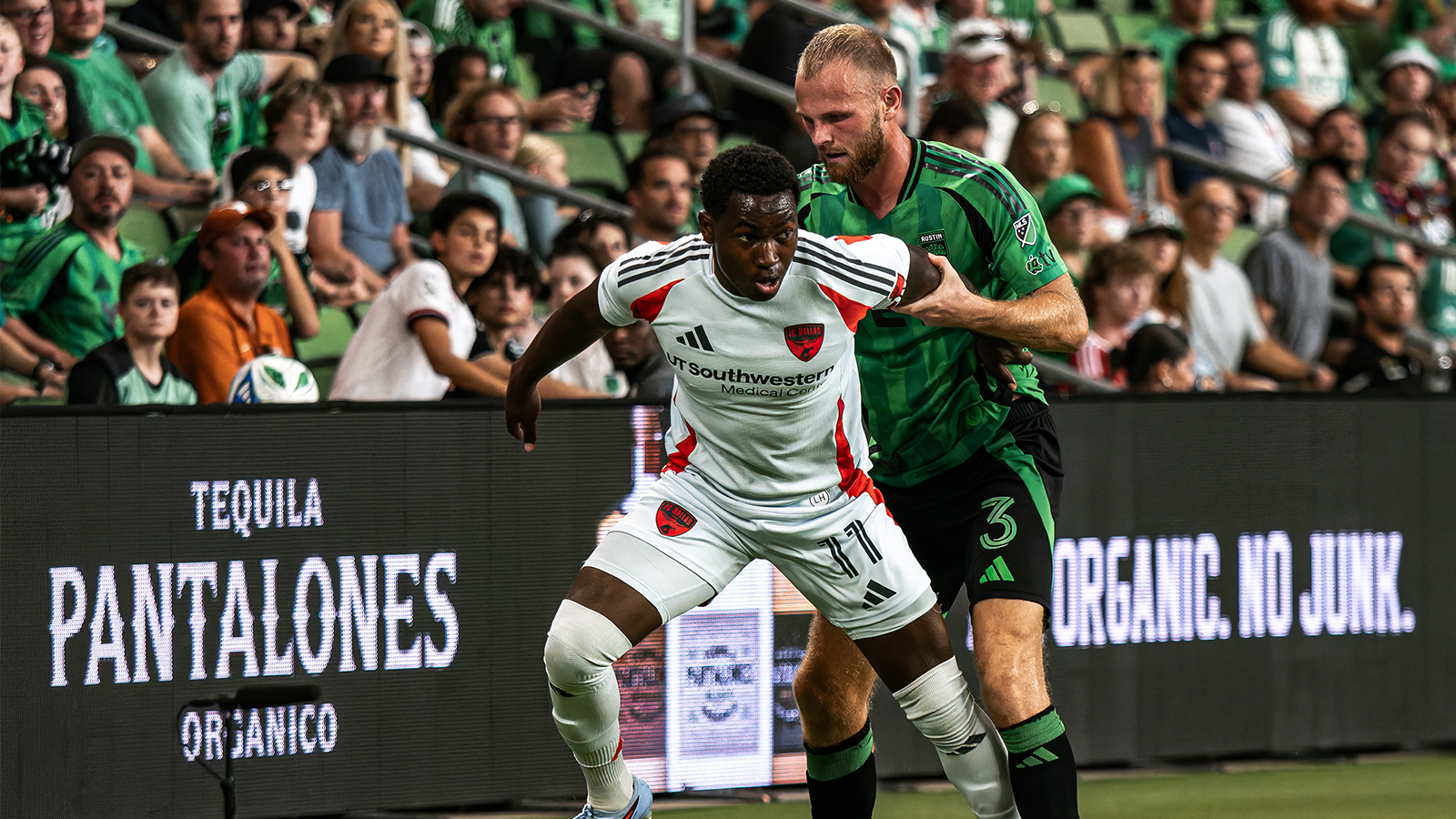 Austin FC's Mikkel Desler handling an FC Dallas player 