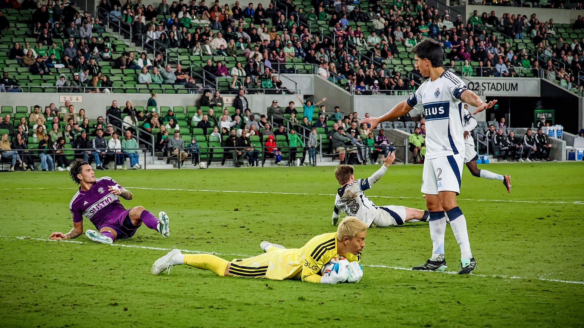 Mathias Laborda appears to call for calm as Brandon Vázquez, Yohei Takoaka, and Tate Johnson are all sprawled on the ground
