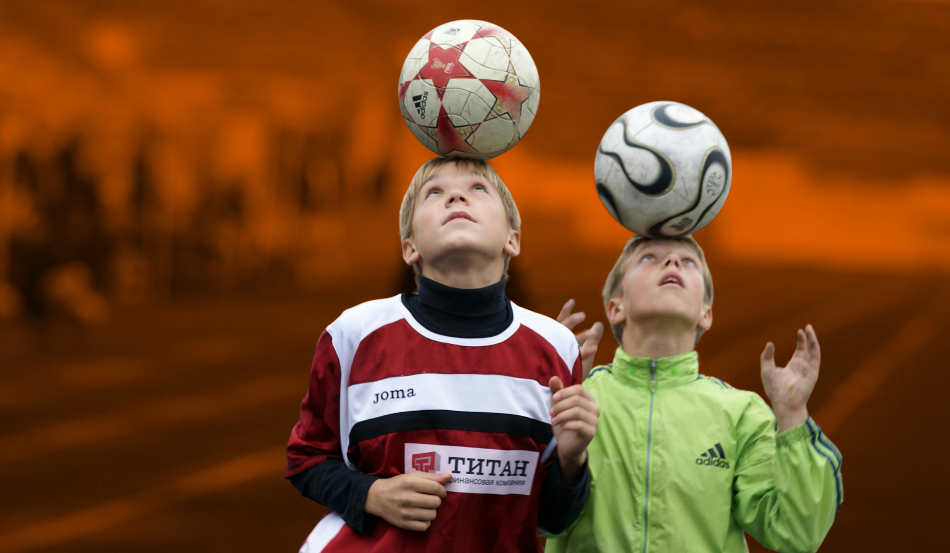 Boy playing soccer controlling the ball with his head
