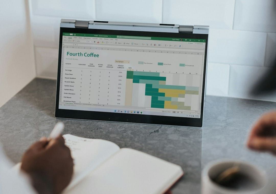 A MacBook Pro displays cloud-based accounting software with financial dashboards and charts, illustrating efficient small business financial management.