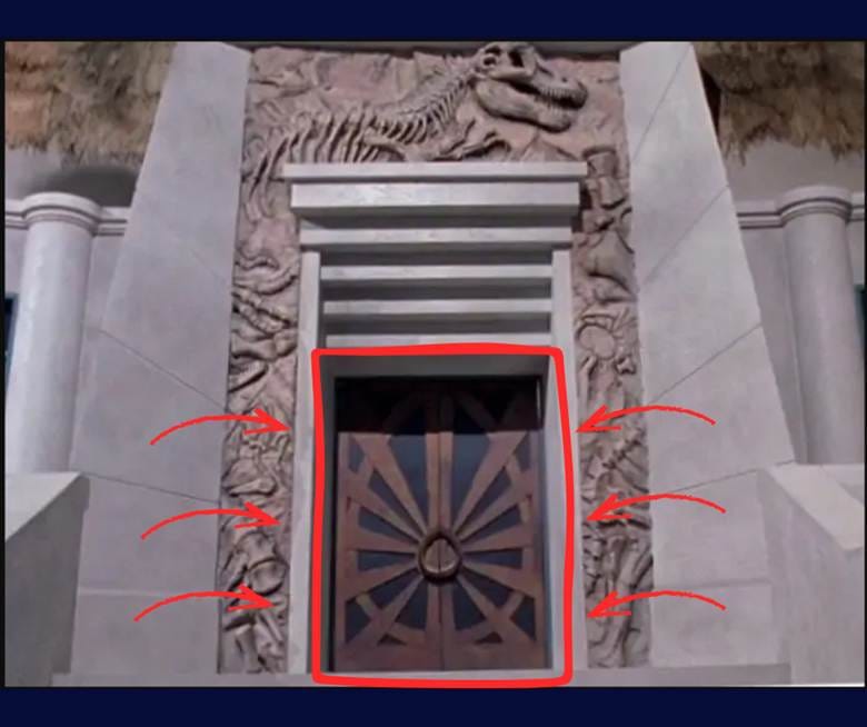 The same close-up image of the entryway, used above, with the egg shape and superimposed sunburst called out in a red line mark-up 