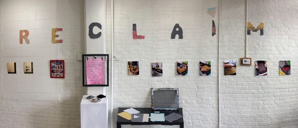 Photographs show the paper-making process above examples of the torn fabric, a screen for collecting paper pulp, and some finished handmade paper.