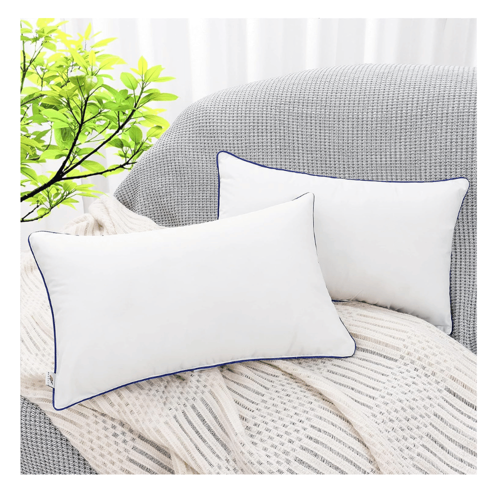 two Wuuyuef pillow inserts with blue piping resting on gray sofa and cream knit throw blanket (C: Wuuyuef/Amazon)