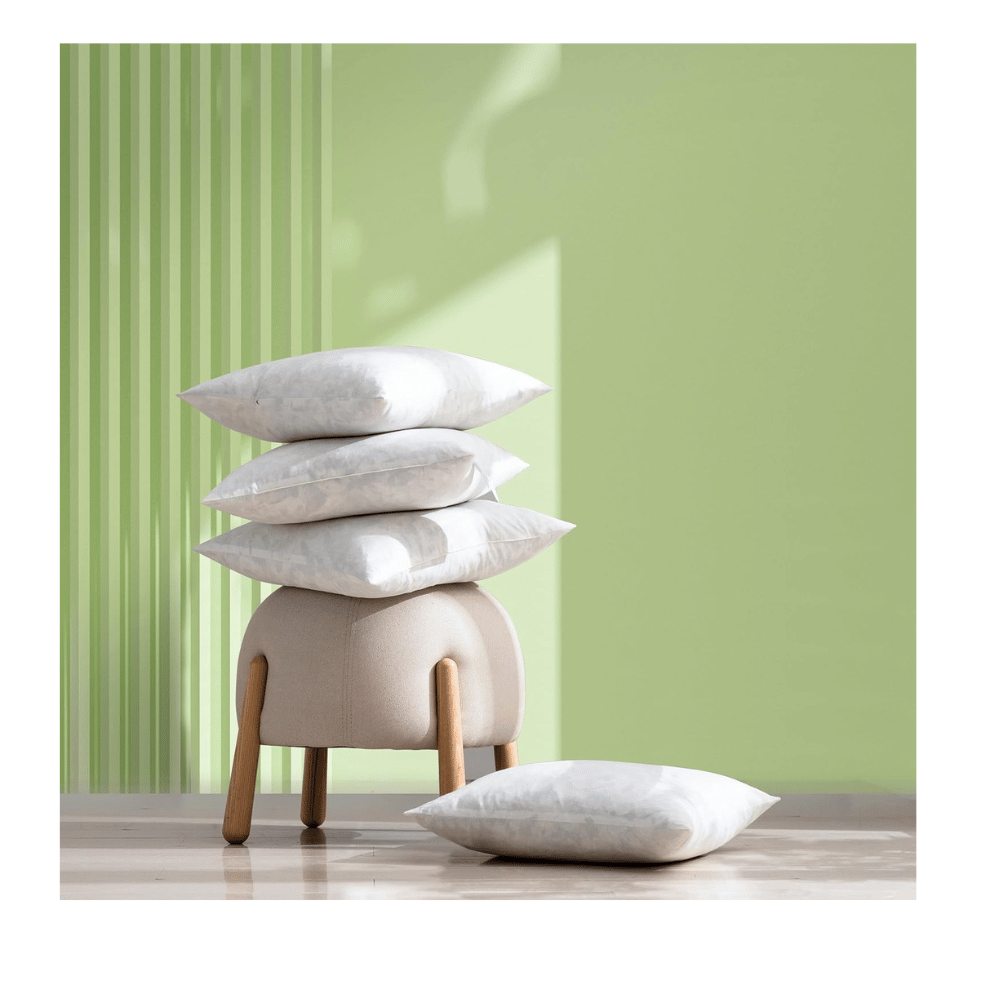 feather pillow inserts styled on small upholstered stool and floor for décor ideas (C: Dorrin Nessin/Amazon)