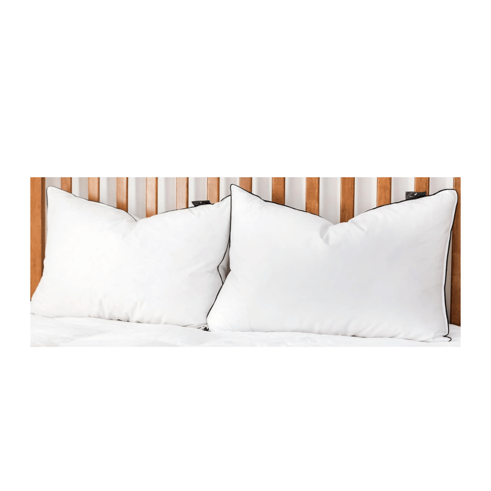 two luxury goose down feather pillows on wooden bed frame for elegant bedroom styling (C: Maison Des Garçon/Amazon)