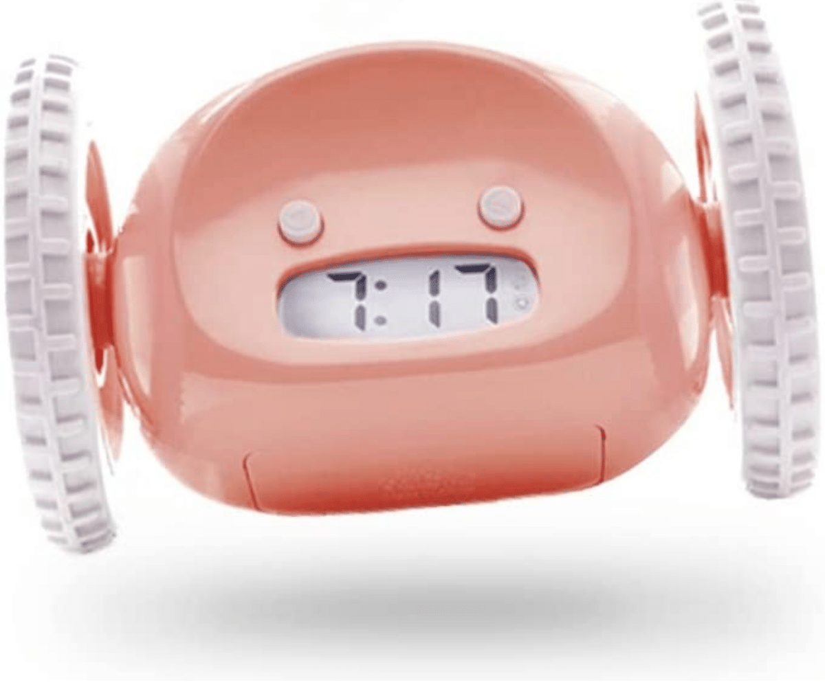pink clocky rolling alarm clock with wheels and digital time displayed (C: Clocky/Amazon)