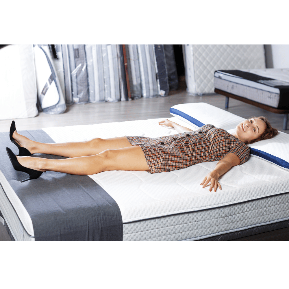 Hispanic woman tests mattress store