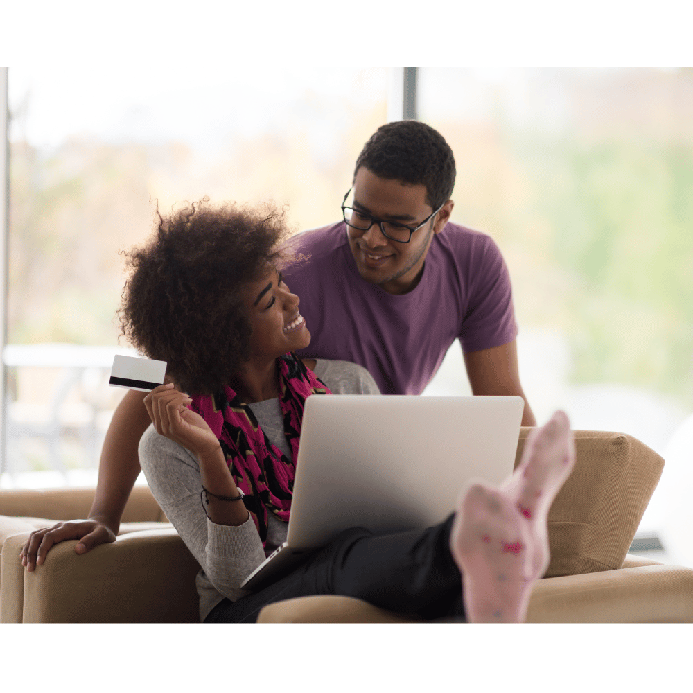 Black couple shopping mattress online