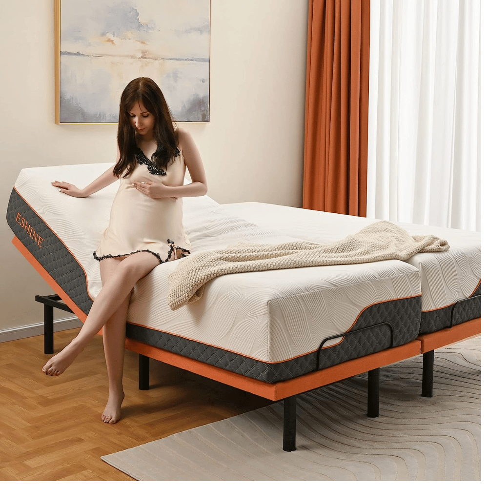 Pregnant woman sitting on adjustable split bed.