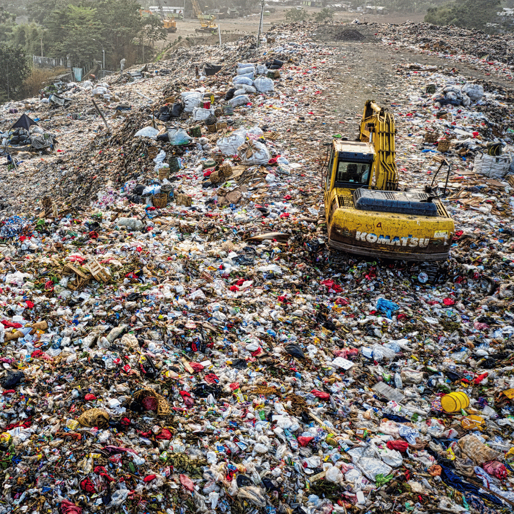 Excavator working at landfill