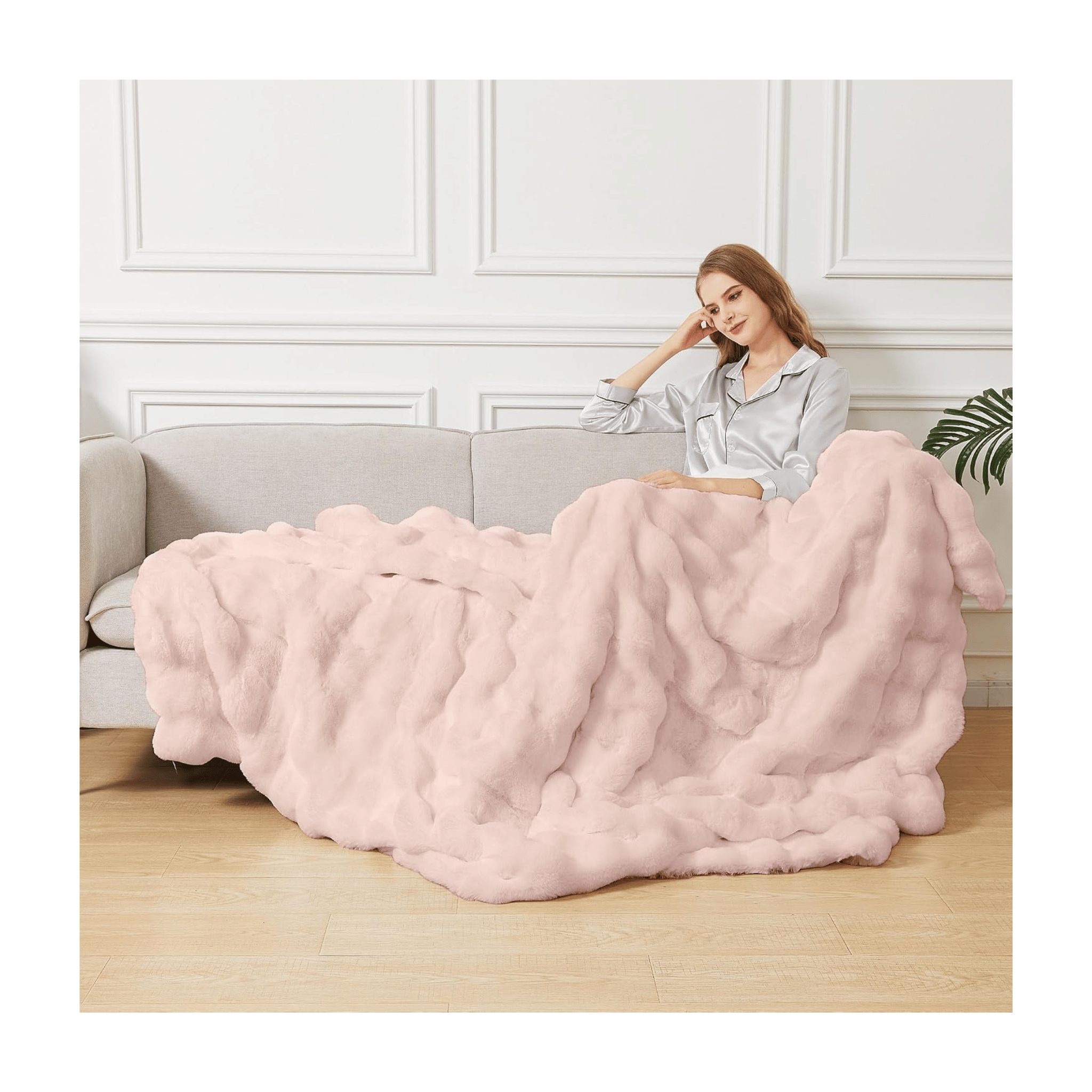 Orinova pink fluffy throw on sofa