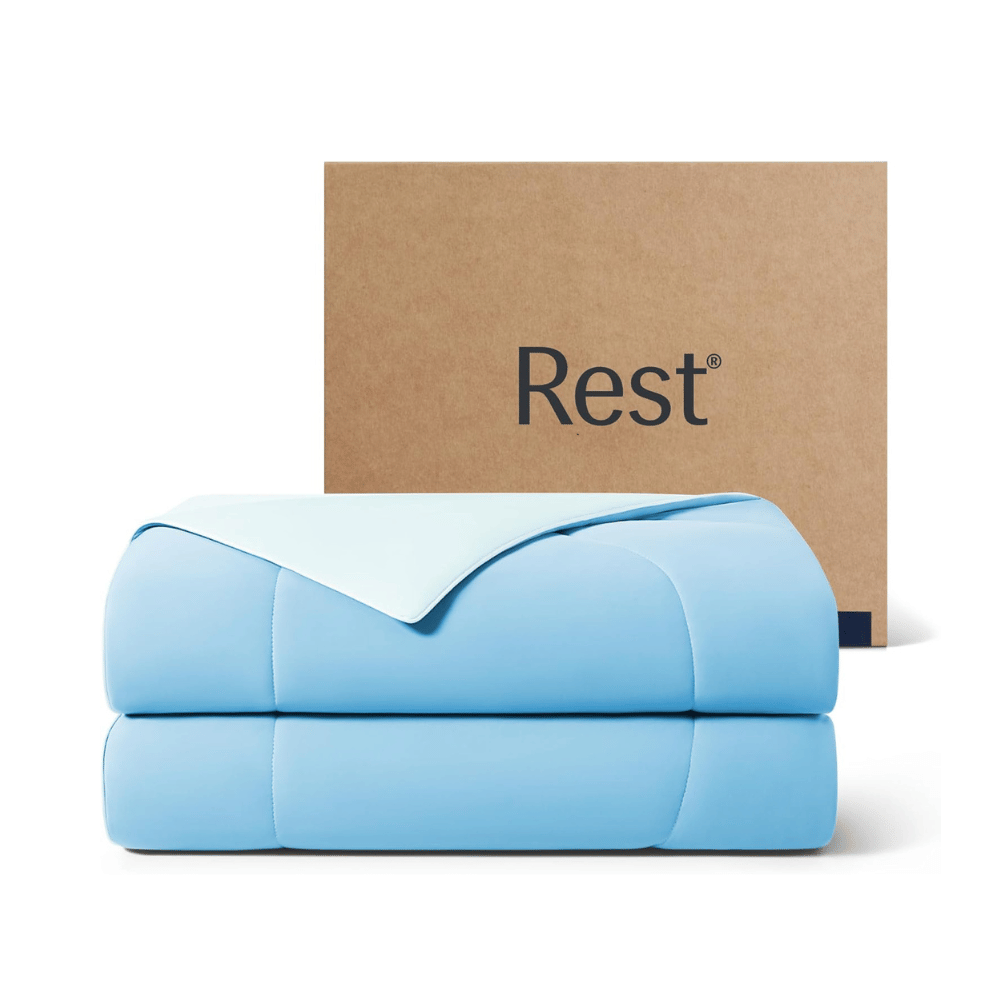 Rest Evercool cooling comforter folded with box behind it blue cooling blanket