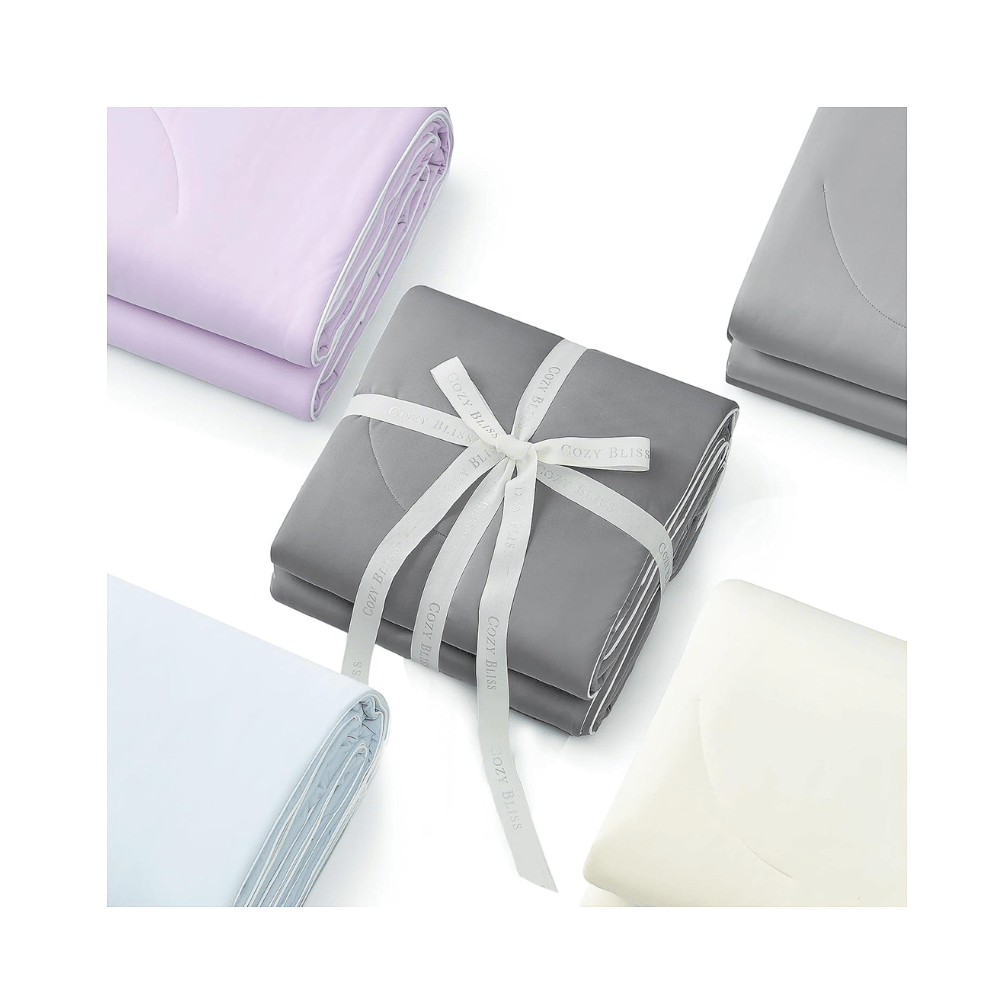 Cozy Bliss cooling comforter folded in multiple colors gift wrapped dual sided blanket